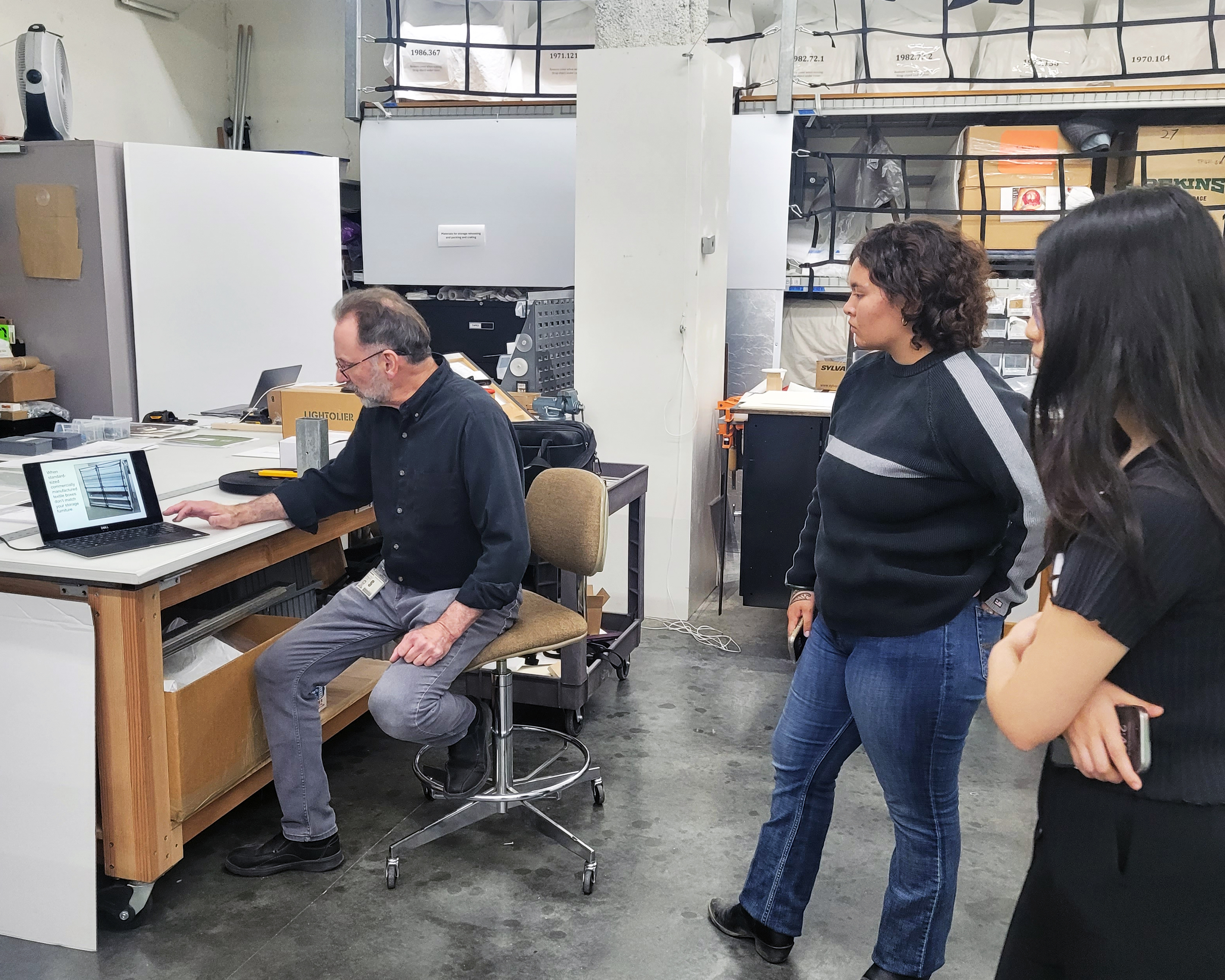 Interns learning how objects are stored at the Cantor