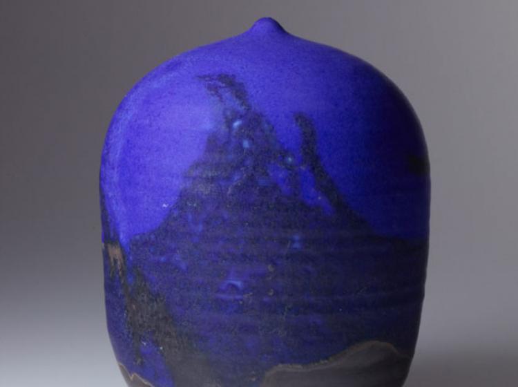 A stoneware vase with glazes