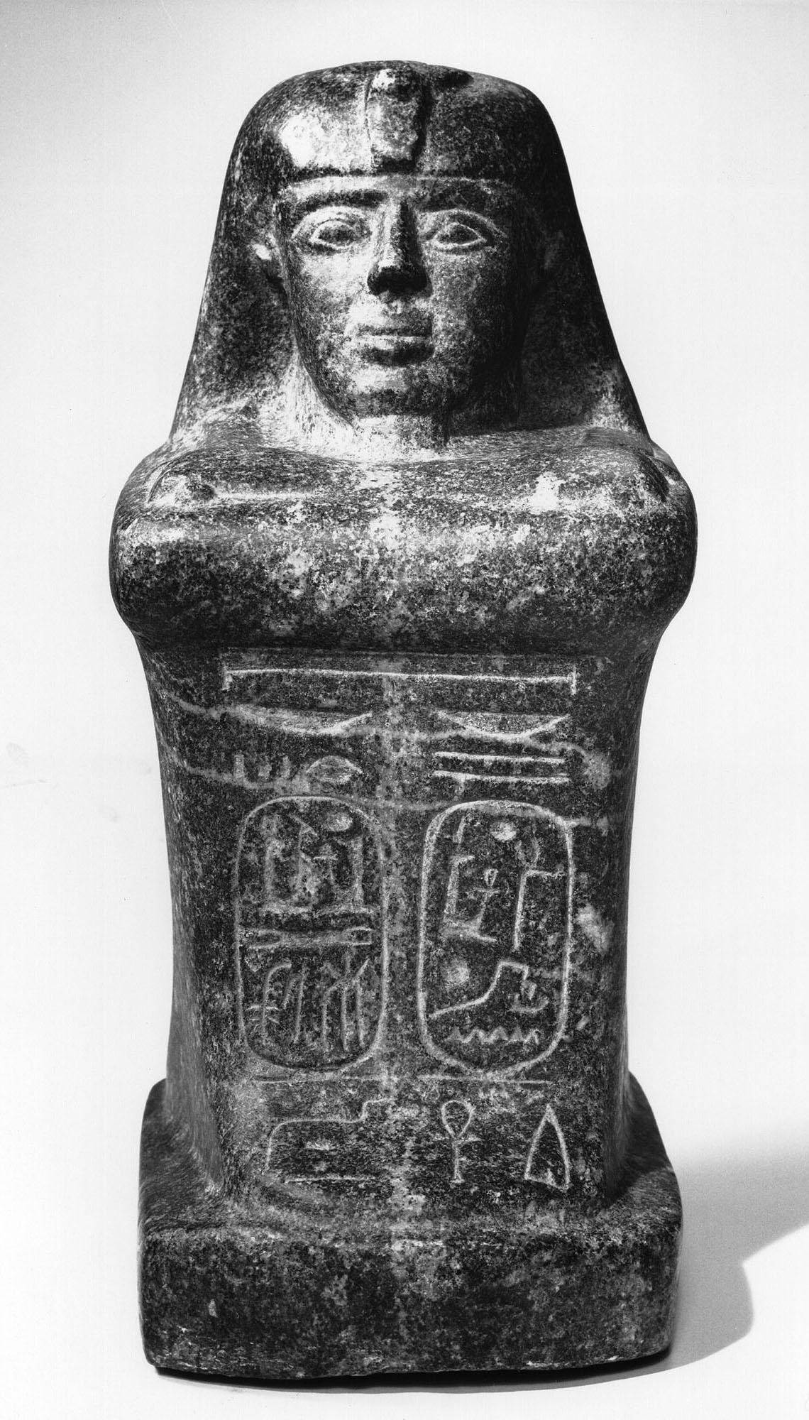 Artist unknown (Egypt), Block Statue with Cartouches of Ramses II, ancient with ancient modifications, c. 712–332 BCE, or 19th-century fake. Granodiorite. Stanford Family Collections, 1966.371