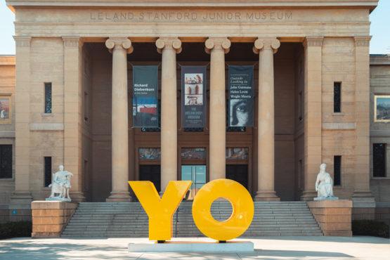 An image of the façade of the Cantor Arts Center with the OY/YO sculpture at the front