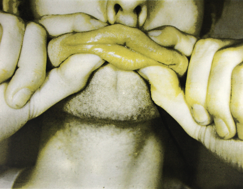 An image of human lips being pressed against each other with fingers
