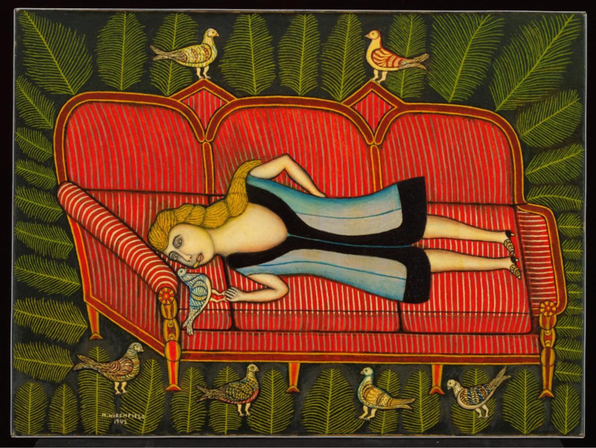 an image of a couch and a woman with two birds