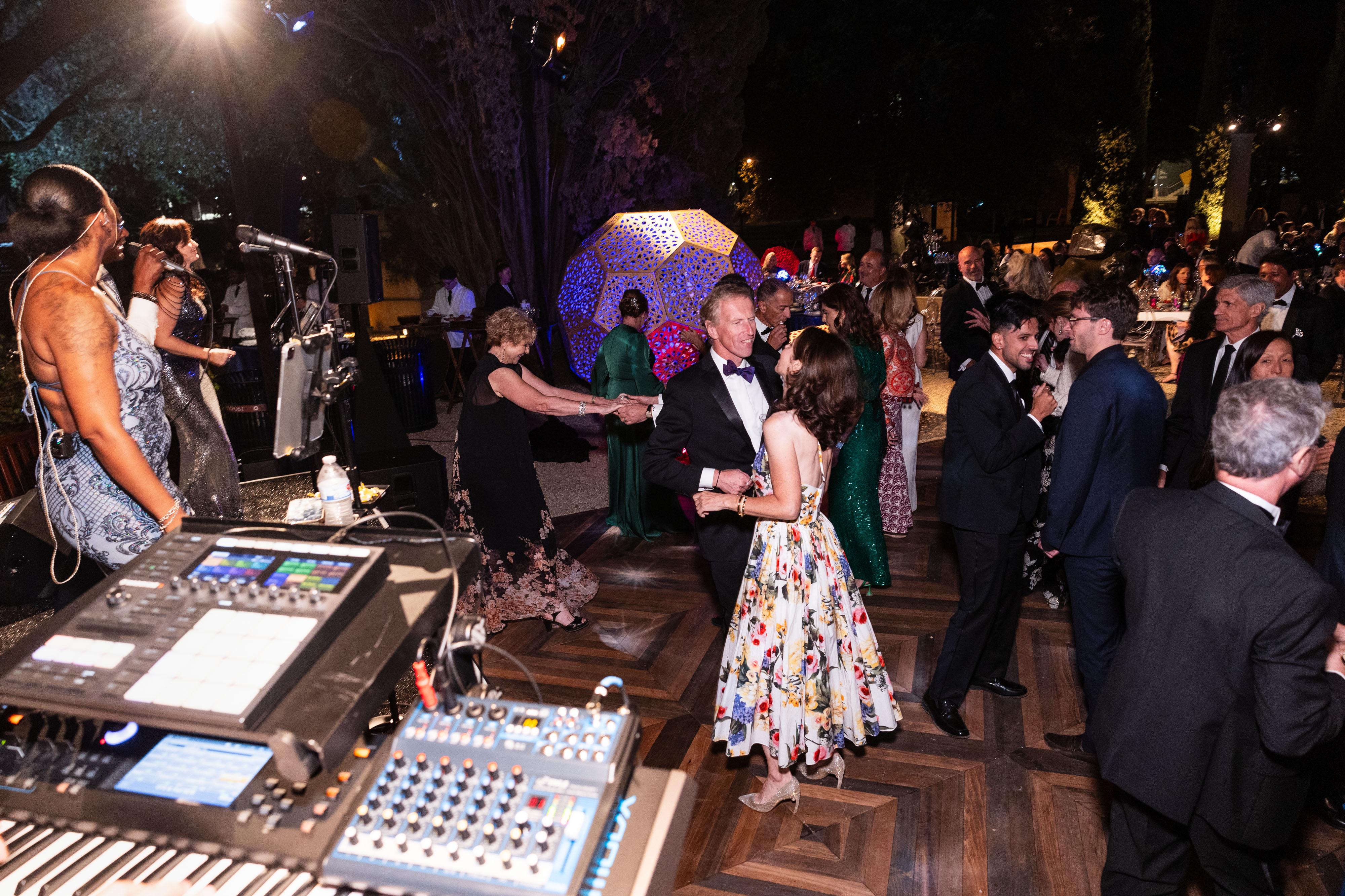 people dancing under the stars during the gala